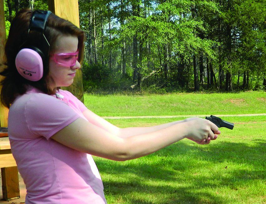 female shooter with High Standard 22 derringer